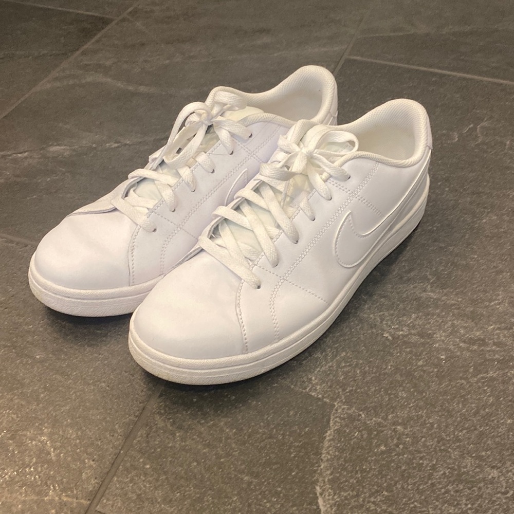 Nike all white leather shoes. Hardy worn. Size 10.5 mens.